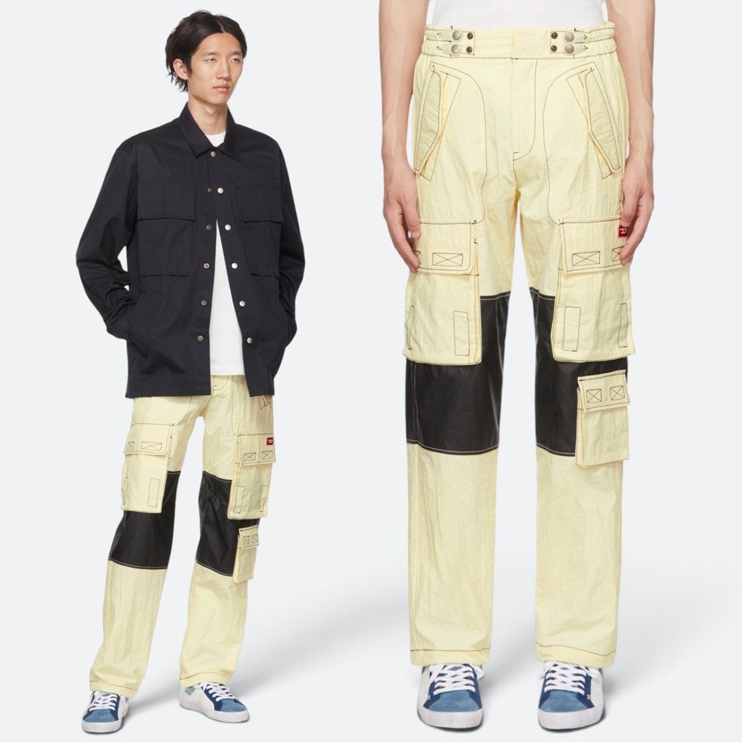 Diesel - Beige Nylon Cargo Pants (Category: Activewear) located in Los Banos. Submitted by declutterking (Listing ID 1465717739, Image 1). Description: Size 32 on tag Paneled plain-woven nylon cargo pants. Adjustable bungee-style button tab fastening at waistband and cuffs. · Zip-fly · Four-pocket styling · Flap pockets and textile logo patch at front · Polyurethane-coated panel at knees. Dimensions: 16.25" waist 12.25" front rise 44" length 9.25