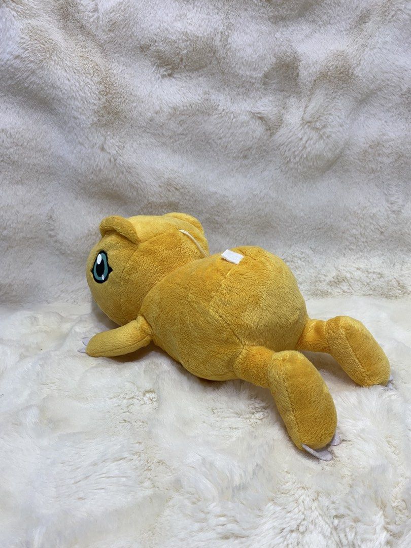 Digimon “laying Agumon” plush (Category: Plushies & Soft Toys) located in Kalibo. Submitted by ollie_stuffshop (Listing ID 1465586626, Image 2). Description: Length: 35cm Before you send your inquiries: ❗️Last Price is already posted ❗️Manage your expectations, WYSIWYG ❗️May need washing ❗️Dropoff is every Wednesday & Sunday - Banpresto on label but faded.