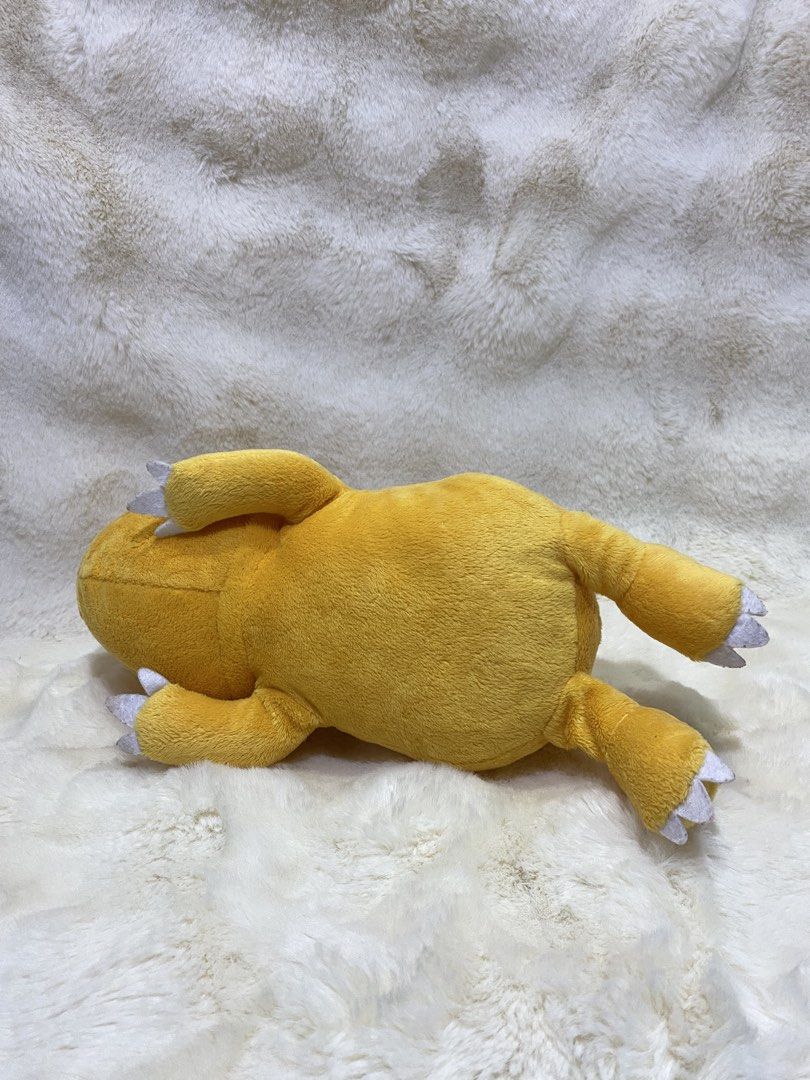 Digimon “laying Agumon” plush (Category: Plushies & Soft Toys) located in Kalibo. Submitted by ollie_stuffshop (Listing ID 1465586626, Image 3). Description: Length: 35cm Before you send your inquiries: ❗️Last Price is already posted ❗️Manage your expectations, WYSIWYG ❗️May need washing ❗️Dropoff is every Wednesday & Sunday - Banpresto on label but faded.