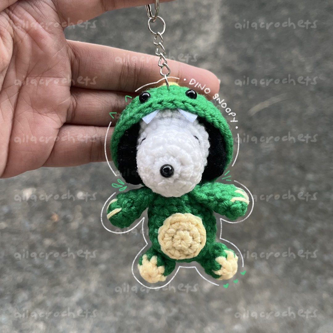Dinosaur Snoopy crochet keychain/charm (Category: Handmade Craft) located in Pasig City. Submitted by ailacrochets (Listing ID 1465680027, Image 2). Description: – available in milk cotton – around 3.5 inches in height – open for customization (50% dp required) mop: gcash, maya, maribank mod: j&t, gogo xpress, lalamove/grab 📍 pasig please message interested + quantity (e.g. interested 1 chucky + 1 pennywise) .