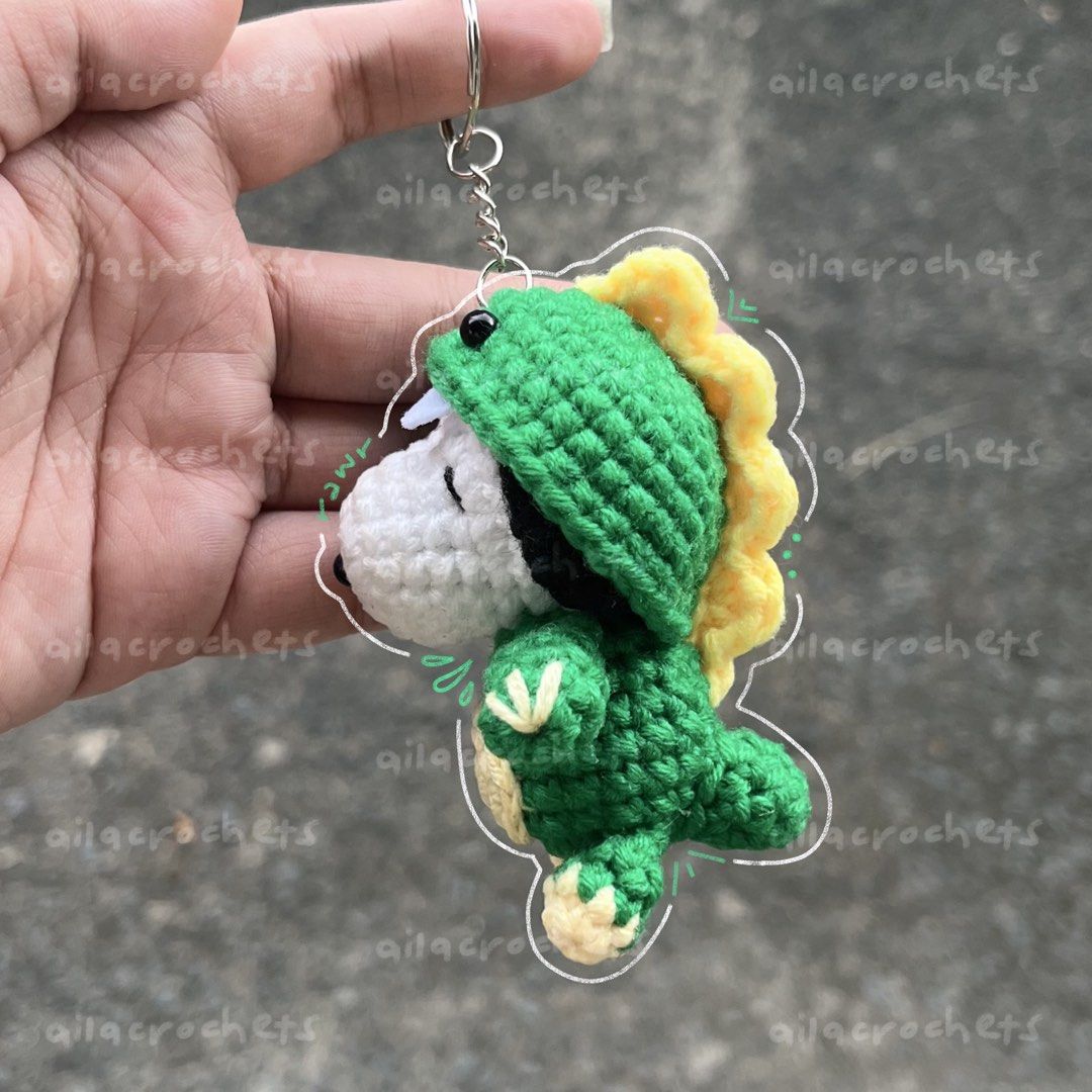 Dinosaur Snoopy crochet keychain/charm (Category: Handmade Craft) located in Pasig City. Submitted by ailacrochets (Listing ID 1465680027, Image 1). Description: – available in milk cotton – around 3.5 inches in height – open for customization (50% dp required) mop: gcash, maya, maribank mod: j&t, gogo xpress, lalamove/grab 📍 pasig please message interested + quantity (e.g. interested 1 chucky + 1 pennywise) .
