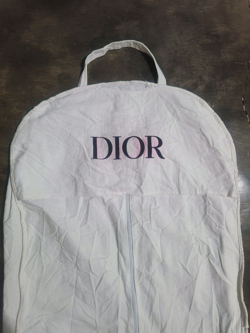 Dior White Canvas Garment Bag Dust Cover (Category: Luxury Bags & Wallets) located in Koronadal. Submitted by zxckeeeny_ (Listing ID 1465715655, Image 3). Description: DIOR Coat Dust Bag ‎22.5x44 ‎very good condition ‎9.2/10 ‎issue: pink stain and light dirt and 2 scratch see last 2 photos.
