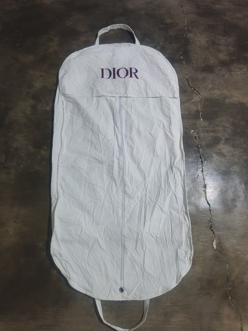 Dior White Canvas Garment Bag Dust Cover (Category: Luxury Bags & Wallets) located in Koronadal. Submitted by zxckeeeny_ (Listing ID 1465715655, Image 2). Description: DIOR Coat Dust Bag ‎22.5x44 ‎very good condition ‎9.2/10 ‎issue: pink stain and light dirt and 2 scratch see last 2 photos.