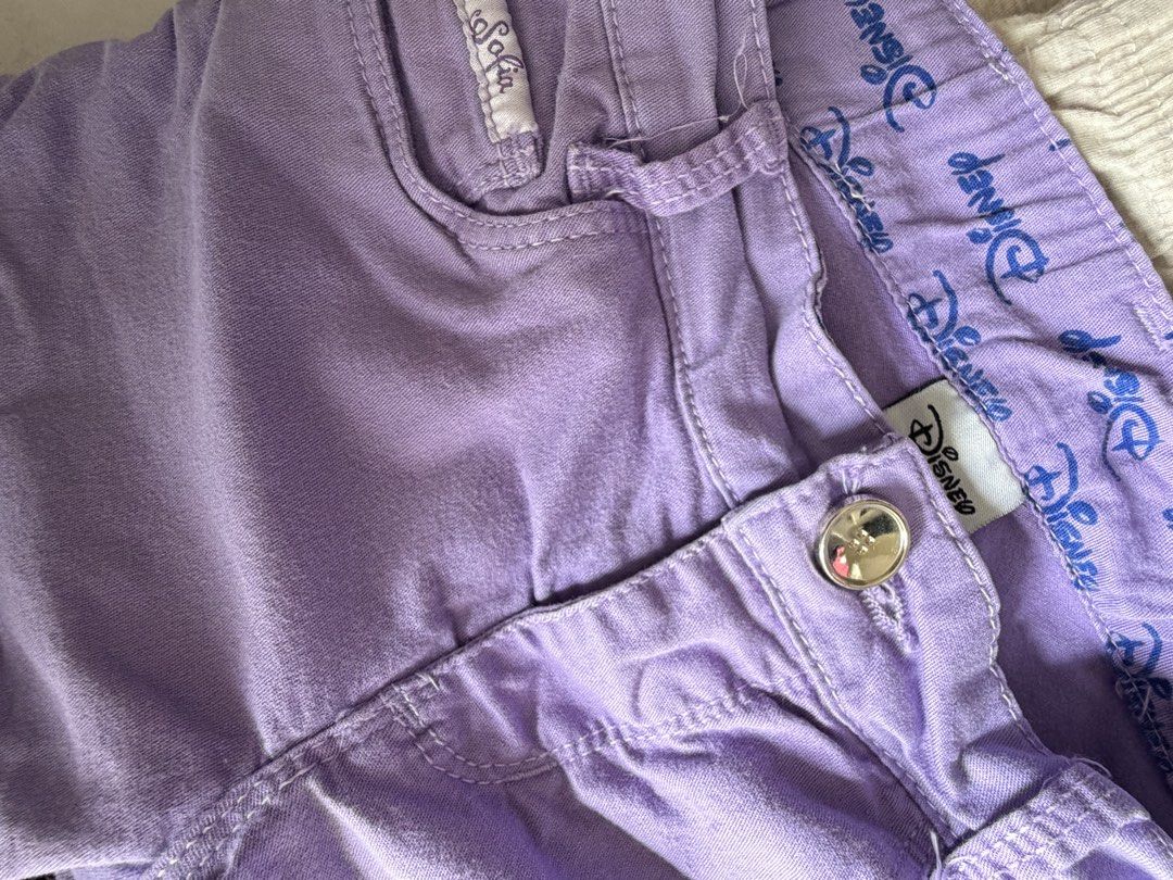 Disney Princess Sofia purple denim shorts (Category: Babies & Kids Fashion) located in Quezon City. Submitted by warmrabbit_414908 (Listing ID 1465595440, Image 3). Description: - Authentic Disney Sofia the First purple denim shorts - Features a sparkly framed Sofia print on the left leg and a small Sofia label on the coin pocket - Detailed with a back right pocket embroidered crest patch and branded interior waistband - Shiny silver button closu