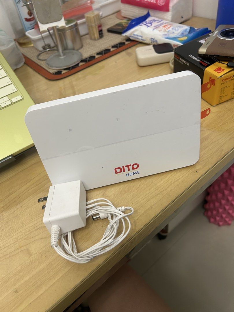 DITO Home Wi-Fi Pro - UNLI 5G data (Category: Networking) located in Manila. Submitted by alainaluague.1 (Listing ID 1465660966, Image 2). Description: - Item: DITO Home Wi-Fi Router (White) - Inclusions: Original power adapter with long white cord - Plug Type: Standard US / two-prong - Condition: Clean body with minor dust marks, fully functional - Features: DITO HOME logo on front, indicator lights on top panel, standard DC barrel jack plug - R