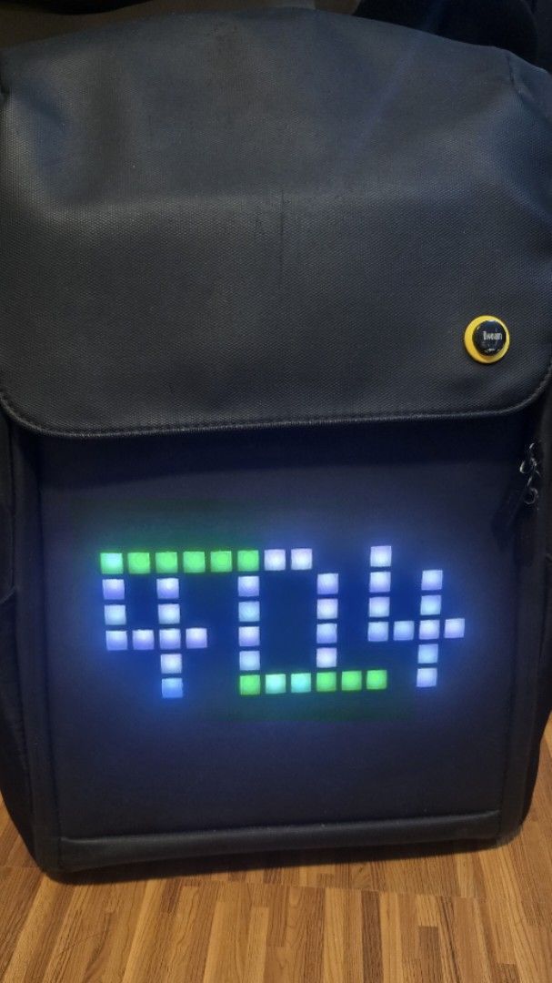 Divoom Pixel Art Backpack M (Category: Backpacks) located in Caloocan City. Submitted by marces (Listing ID 1465687091, Image 2). Description: - Authentic Divoom backpack M in sleek black - Programmable LED pixel display on the front with custom app animations and designs • 16X16 PIXEL RESOLUTION • BLUETOOTH APP CONTROL via Divoom app • WATER-RESISTANT AND DURABLE BUILD I included a free power bank inside the main compartment to power the screen 