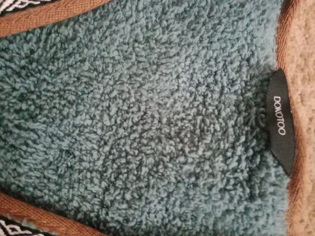 Dokotoo fleece vest (Category: Coats, Jackets and Outerwear) located in Manila. Submitted by kristhine19 (Listing ID 1465653570, Image 3). Description: it’s a sleeveless fleece jacket/vest with toggle (wood-style) closures and front pockets. It looks like a warm, casual outdoor vest..