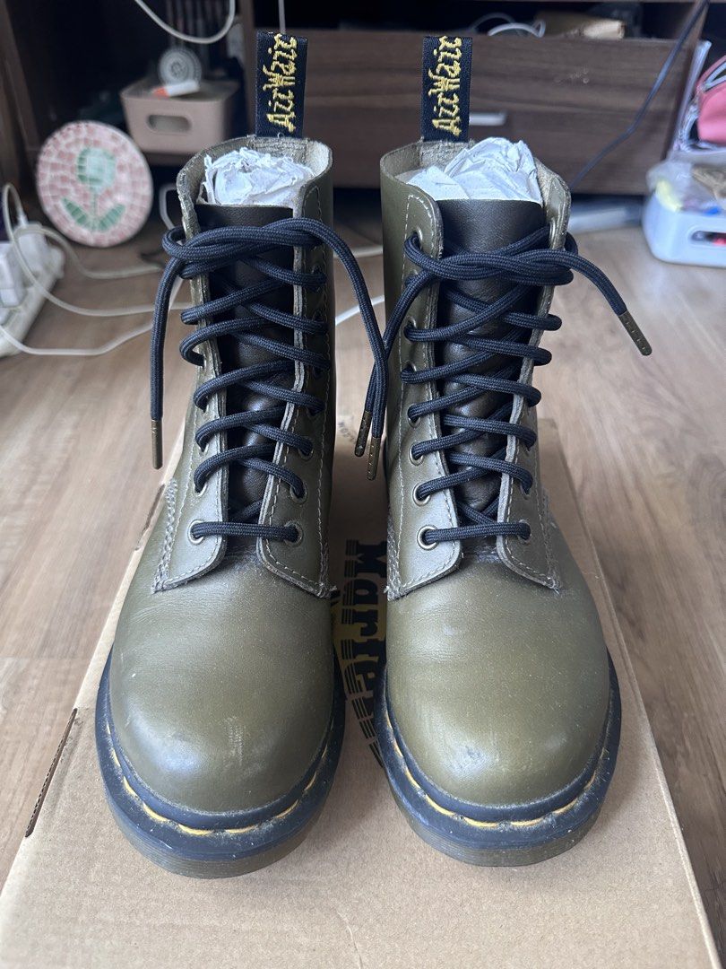 Dr. Martens 1460 Olive Green Leather Boots (Category: Boots) located in Makati City. Submitted by rnavarrojr (Listing ID 1465641296, Image 3). Description: - Brand: Dr. Martens Wanama leather - Size 5 US Women’s / 3 UK / 36 EU - Color: Olive Green - Material: made of softer Wanama genuine leather, making it more comfortable than standard DMs. - Style: Classic 8-eye lace-up with iconic yellow welt stitching and AirWair heel loops - Inclusions: Ori