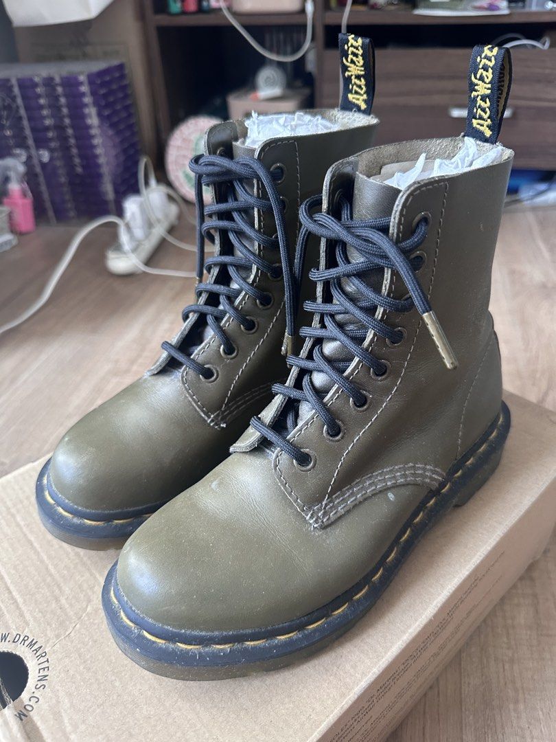 Dr. Martens 1460 Olive Green Leather Boots (Category: Boots) located in Makati City. Submitted by rnavarrojr (Listing ID 1465641296, Image 1). Description: - Brand: Dr. Martens Wanama leather - Size 5 US Women’s / 3 UK / 36 EU - Color: Olive Green - Material: made of softer Wanama genuine leather, making it more comfortable than standard DMs. - Style: Classic 8-eye lace-up with iconic yellow welt stitching and AirWair heel loops - Inclusions: Ori