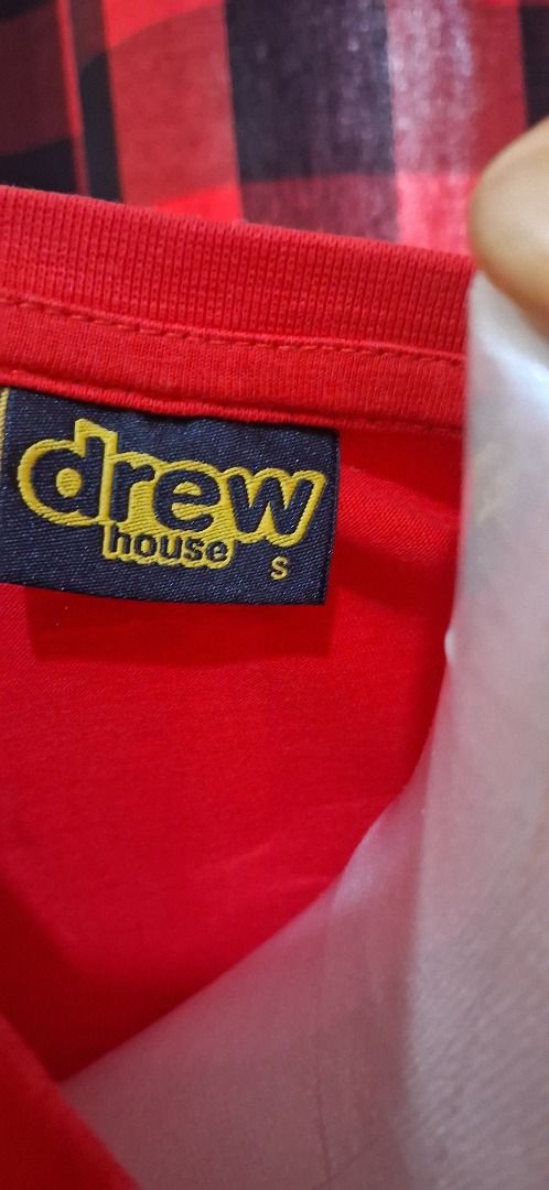 Drew House Red Graphic Tee Size S (Category: Tshirts & Polo Shirts ) located in Manila. Submitted by katkween23 (Listing ID 1465638076, Image 3). Description: - Brand: Drew House - Color: Red - Size: Small - Condition: Brand new, still sealed in original packaging with smiley sticker - Design: Bold textured DREW logo on chest - Fit/Feel: Short sleeves, crew neck, soft and comfortable fabric - Style: Casual streetwear.