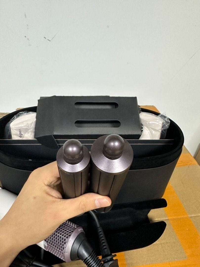 Dyson Airwrap Complete Long HS05 (Category: Hair) located in Paranaque City. Submitted by swiftriver-f167a7 (Listing ID 1465667751, Image 3). Description: - Complete multi-styler set in White and Rose Gold - Includes barrel attachments, smoothing brushes, and round volumizing brush - Comes with original presentation case and outer box - Handle mechanism and buttons in clean working order - All attachments accounted for and stored neatly inside ve