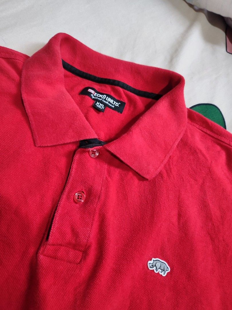 Ecko Unltd Red Polo Shirt XXL (Category: Tshirts & Polo Shirts ) located in Manila. Submitted by mommyregsthriftclothes (Listing ID 1465632309, Image 1). Description: - Brand: Ecko Unltd - Color: Bright Red - Size: XXL - Material/Origin: Made in India - Details: Embroidered rhino logo on chest, small rhino tag on back collar, classic collar with 3-button placket, black contrast tape inside neckline - Condition: Classic casual staple, great for ev