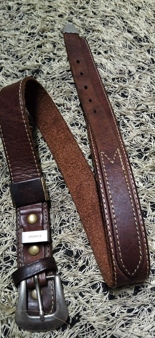 Edwin Brown Leather Belt with Metal Hardware (Category: Belts) located in Paranaque City. Submitted by michael-08 (Listing ID 1465605307, Image 1). Description: - Brand: Edwin - Material: Genuine leather with suede underside - Details: Heavy stitching, metallic studs, and branded metal loop - Hardware: Silver-tone buckle and tip - Condition: Rich patina and natural distressing for a vintage looks EDWIN PURE GENUINE LEATHER ANG KAPAL PO NG PAG KA 