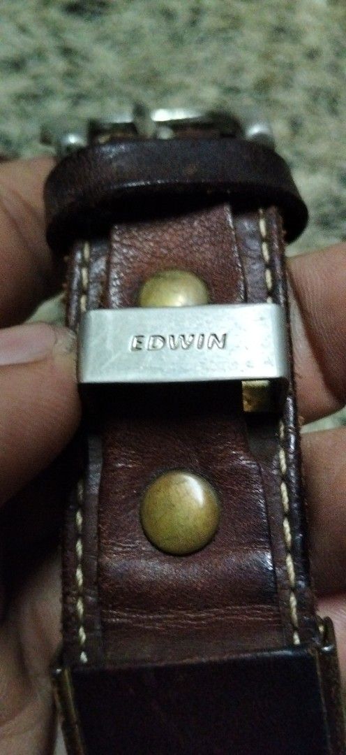Edwin Brown Leather Belt with Metal Hardware (Category: Belts) located in Paranaque City. Submitted by michael-08 (Listing ID 1465605307, Image 2). Description: - Brand: Edwin - Material: Genuine leather with suede underside - Details: Heavy stitching, metallic studs, and branded metal loop - Hardware: Silver-tone buckle and tip - Condition: Rich patina and natural distressing for a vintage looks EDWIN PURE GENUINE LEATHER ANG KAPAL PO NG PAG KA 