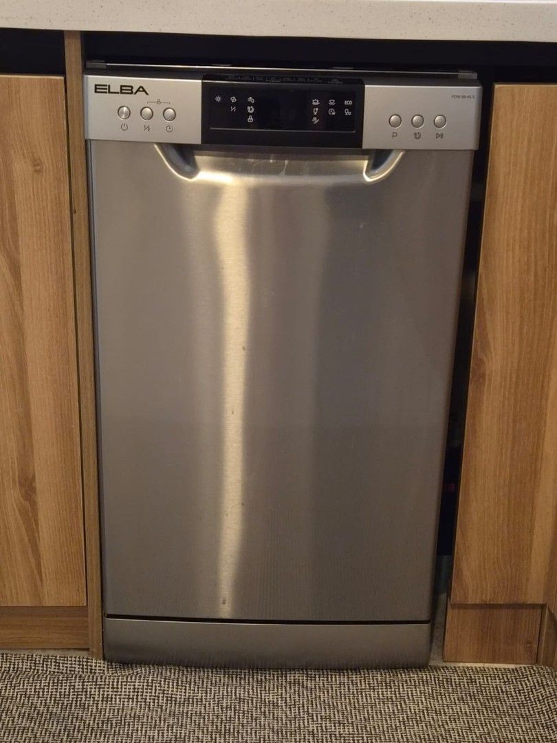 Elba 45cm Free Standing Dishwasher (Category: Dishwasher) located in Makati City. Submitted by catfs (Listing ID 1465654810, Image 2). Description: - Model: Elba FDW99 45S Freestanding Dishwasher (Silver) - Space-saving slim 45cm width, ideal for compact kitchens - 9 place settings capacity with 2 pull-out wire racks and a cutlery basket - User-friendly digital control panel with multiple wash programs - Clean interior - Previously installed unde