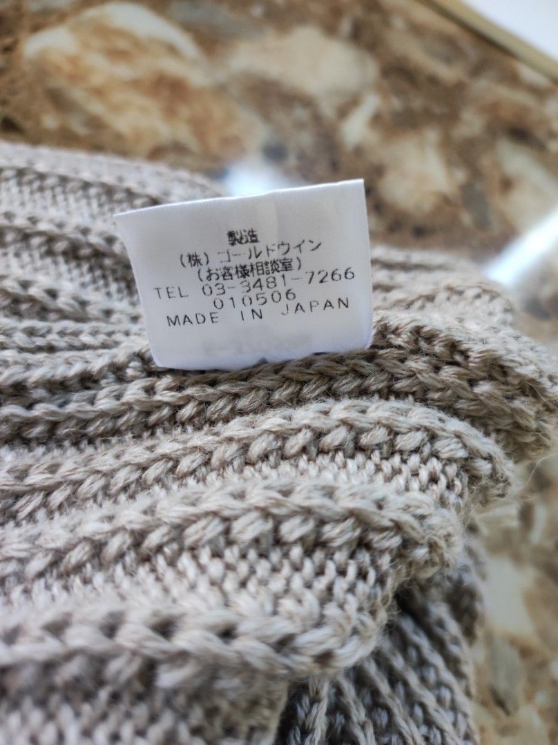 Ellesse Ribbed Beanie Hat (Category: Caps & Hats) located in Batangas. Submitted by astrofinds_ (Listing ID 1465597708, Image 3). Description: - Brand: Ellesse by Goldwin (Made in Japan) - Style: Classic ribbed knit beanie with dark stripe detail - Color: Beige - Material: 50% Wool, 50% Acrylic - Features: Small embroidered Ellesse logo patch near the brim - Model Code: E-37058N - Condition: Excellent, ready to wear - Perfect for daily use, cold 