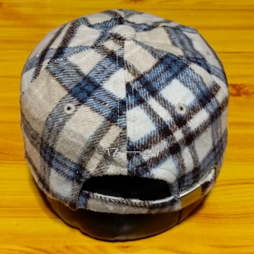 Emis Check Wool Ball Cap Blue Brown (Category: Caps & Hats) located in Manila. Submitted by caps08 (Listing ID 1465745364, Image 3). Description: - Brand: EMIS - Design: Classic 6-panel wool cap with blue and brown plaid pattern - Details: Embroidered logo on front and back - Fit: Adjustable metal buckle strap with embossed brand logo - Material: Warm fabric, ideal for colder days - Condition: Clean and well-maintained overall.