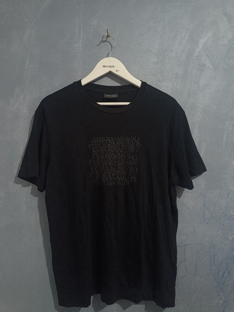 Emporio Armani Black Graphic Tee (Category: Tshirts & Polo Shirts ) located in Iloilo. Submitted by wendxcz-thrift- (Listing ID 1465706308, Image 1). Description: - Brand: Emporio Armani - Color: Black - Style: Short-sleeve crew neck t-shirt - Design: Tonal layered block logo on chest - Material: Soft and breathable cotton for daily wear - Authenticity: Includes tagged neckline and authentic Certilogo tag - Condition: Clean with no flaws or fadin