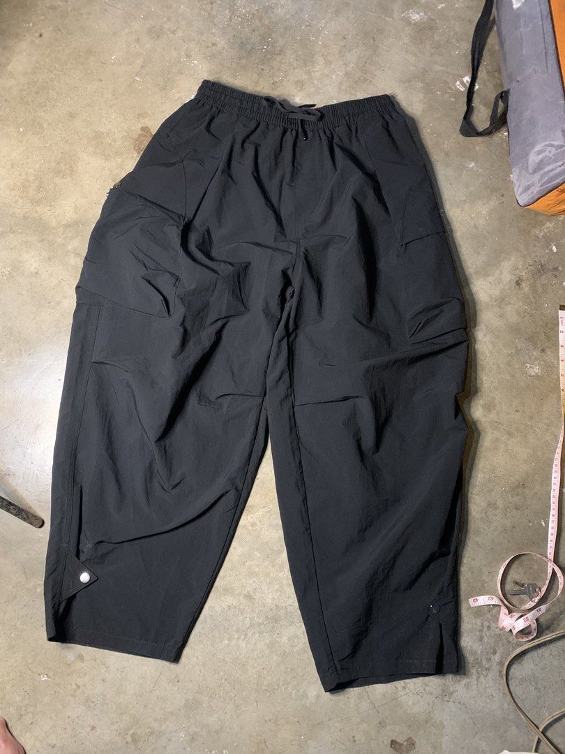 Engrave Black Cargo Parachute Pants 100% Polyester (Category: Joggers) located in Manila. Submitted by armamentoj94205 (Listing ID 1465716736, Image 1). Description: - Brand: Engrave - Color: Black - Material: 100% lightweight polyester - Style: Baggy parachute cargo pants - Fit: Elastic waistband with adjustable drawstring - Features: Side pockets and snap button details at the hem - Condition: Clean and well-maintained.