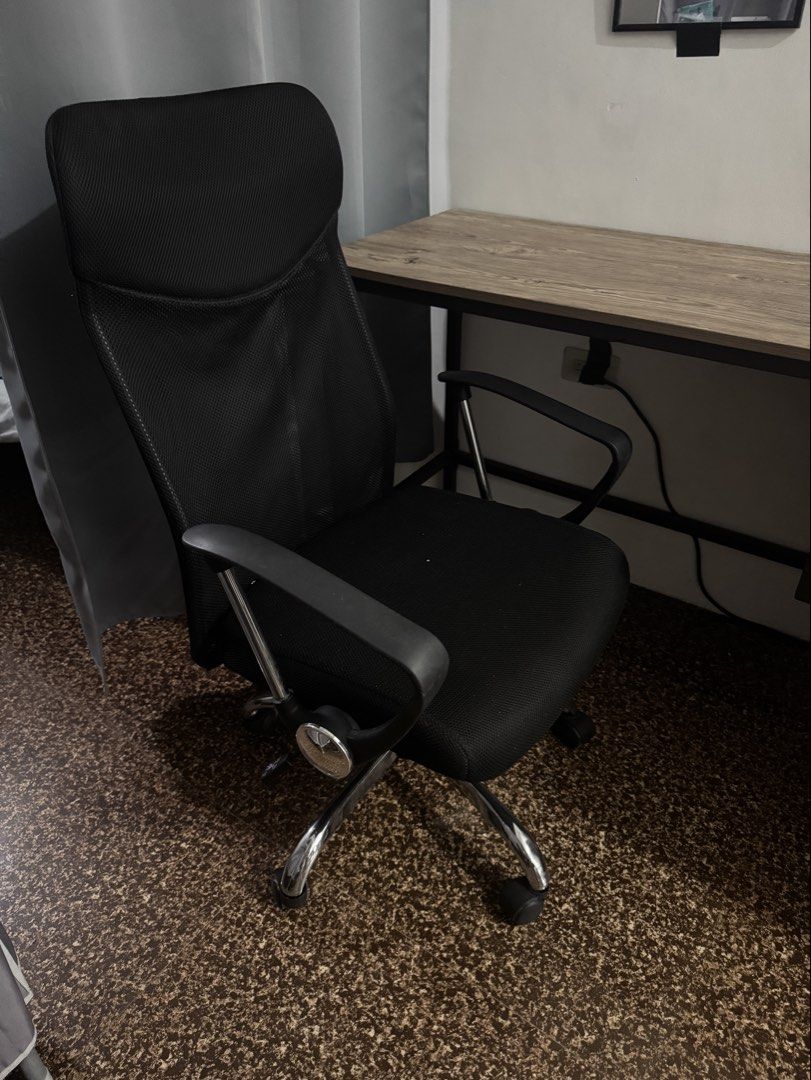 Ergonomic Mesh Office Chair (Category: Office Furniture & Fixtures) located in Taguig. Submitted by johnsteven22 (Listing ID 1465608371, Image 1). Description: - Complete home office setup: Black mesh high-back chair & matching study desk - Chair features: Rolling wheels, chrome base, and adjustable armrests - Condition: Clean, well-maintained, with minimal wear - Ideal for: Home office, bedroom workspace, or student study area - Location/Deliver