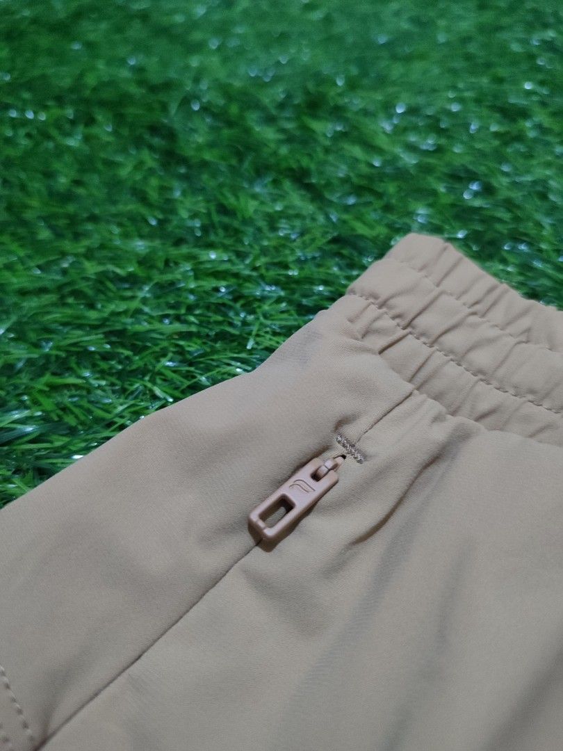 Fabletics Athletic Shorts Men (Category: Activewear) located in Cebu City. Submitted by deadjay84 (Listing ID 1465686224, Image 3). Description: - Brand: Fabletics - Color: Tan/khaki - Size: L (Tag attached) - Material: Body (79% nylon, 21% elastane), Contrast (100% polyester) - Features: Elastic waistband with adjustable dipped-tip drawstring - Pockets: Two secure side zipper pockets - Details: Small reflective logo on leg hem - Fit: Measures ap