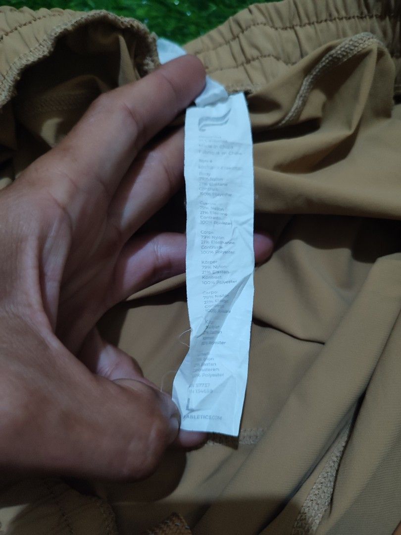 Fabletics Athletic Shorts Men (Category: Activewear) located in Cebu City. Submitted by deadjay84 (Listing ID 1465686224, Image 2). Description: - Brand: Fabletics - Color: Tan/khaki - Size: L (Tag attached) - Material: Body (79% nylon, 21% elastane), Contrast (100% polyester) - Features: Elastic waistband with adjustable dipped-tip drawstring - Pockets: Two secure side zipper pockets - Details: Small reflective logo on leg hem - Fit: Measures ap