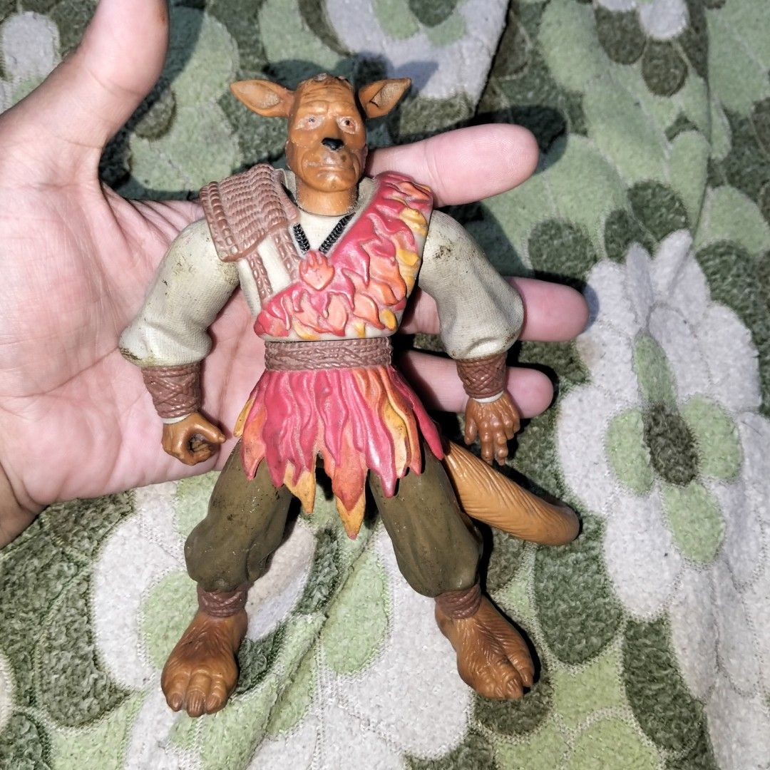 Fantasy Animal Warrior Action Figure (Category: Figurines & Statues) located in Pasig City. Submitted by kat_grande (Listing ID 1465711449, Image 1). Description: - Rare anthropomorphic animal warrior action figure - Features fully jointed limbs for dynamic posing - Detailed sculpted armor on shoulder and chest - Textured shirt with red flame patterns and brown pants with wrapped ankles - Condition: Minor scuffs and marks on fabric shirt due to a