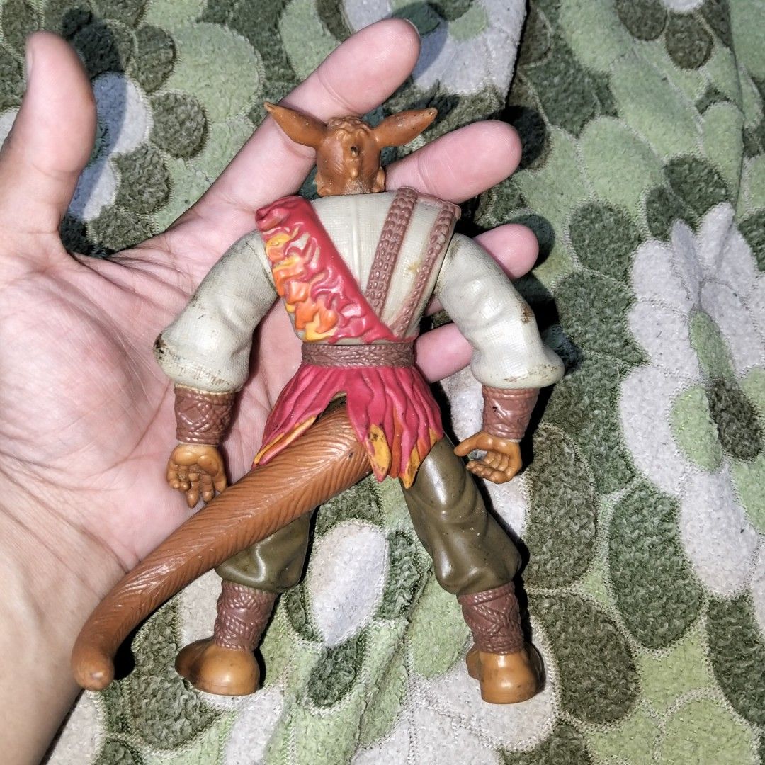 Fantasy Animal Warrior Action Figure (Category: Figurines & Statues) located in Pasig City. Submitted by kat_grande (Listing ID 1465711449, Image 2). Description: - Rare anthropomorphic animal warrior action figure - Features fully jointed limbs for dynamic posing - Detailed sculpted armor on shoulder and chest - Textured shirt with red flame patterns and brown pants with wrapped ankles - Condition: Minor scuffs and marks on fabric shirt due to a
