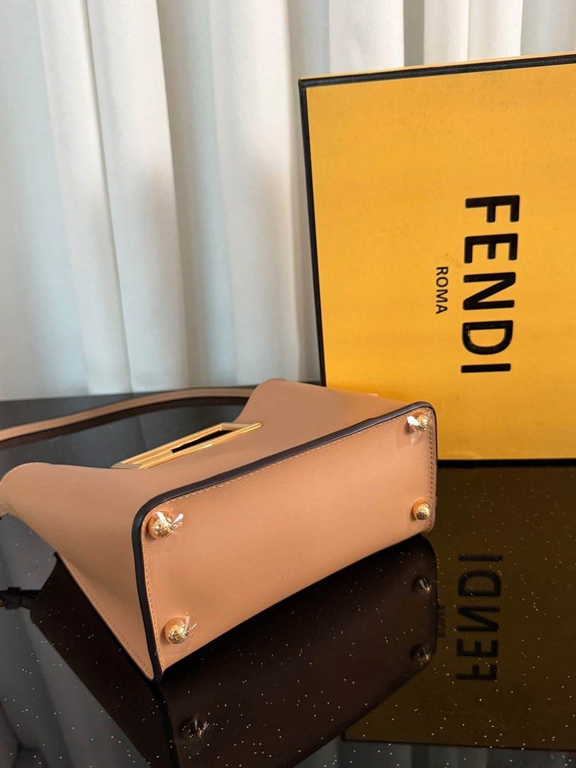 Fendi Sunshine Shopper Medium Leather Tote Bag (Category: Tote Bags) located in Manila. Submitted by bagsandmanymanymore1 (Listing ID 1465596888, Image 3). Description: - Brand: Fendi - Model: Sunshine Shopper Tote -Size 20cm - Color: Beige leather with gold-finish hardware - Distinctive rigid tortoiseshell-effect plexiglass handles - Features hot-stamped Fendi Roma logo - Suede-lined interior with a convenient flat pocket - Includes adjustable a