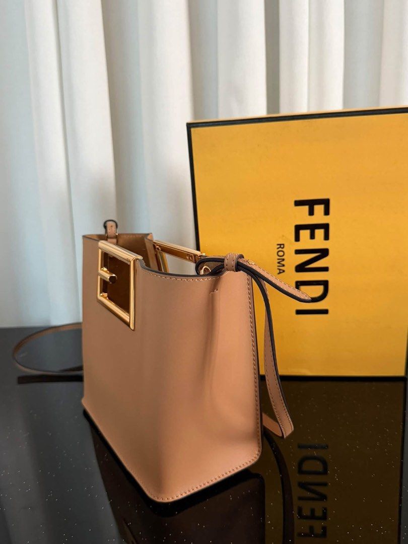 Fendi Sunshine Shopper Medium Leather Tote Bag (Category: Tote Bags) located in Manila. Submitted by bagsandmanymanymore1 (Listing ID 1465596888, Image 2). Description: - Brand: Fendi - Model: Sunshine Shopper Tote -Size 20cm - Color: Beige leather with gold-finish hardware - Distinctive rigid tortoiseshell-effect plexiglass handles - Features hot-stamped Fendi Roma logo - Suede-lined interior with a convenient flat pocket - Includes adjustable a
