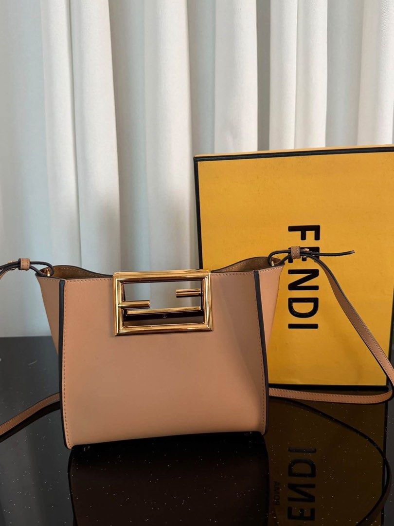 Fendi Sunshine Shopper Medium Leather Tote Bag (Category: Tote Bags) located in Manila. Submitted by bagsandmanymanymore1 (Listing ID 1465596888, Image 1). Description: - Brand: Fendi - Model: Sunshine Shopper Tote -Size 20cm - Color: Beige leather with gold-finish hardware - Distinctive rigid tortoiseshell-effect plexiglass handles - Features hot-stamped Fendi Roma logo - Suede-lined interior with a convenient flat pocket - Includes adjustable a