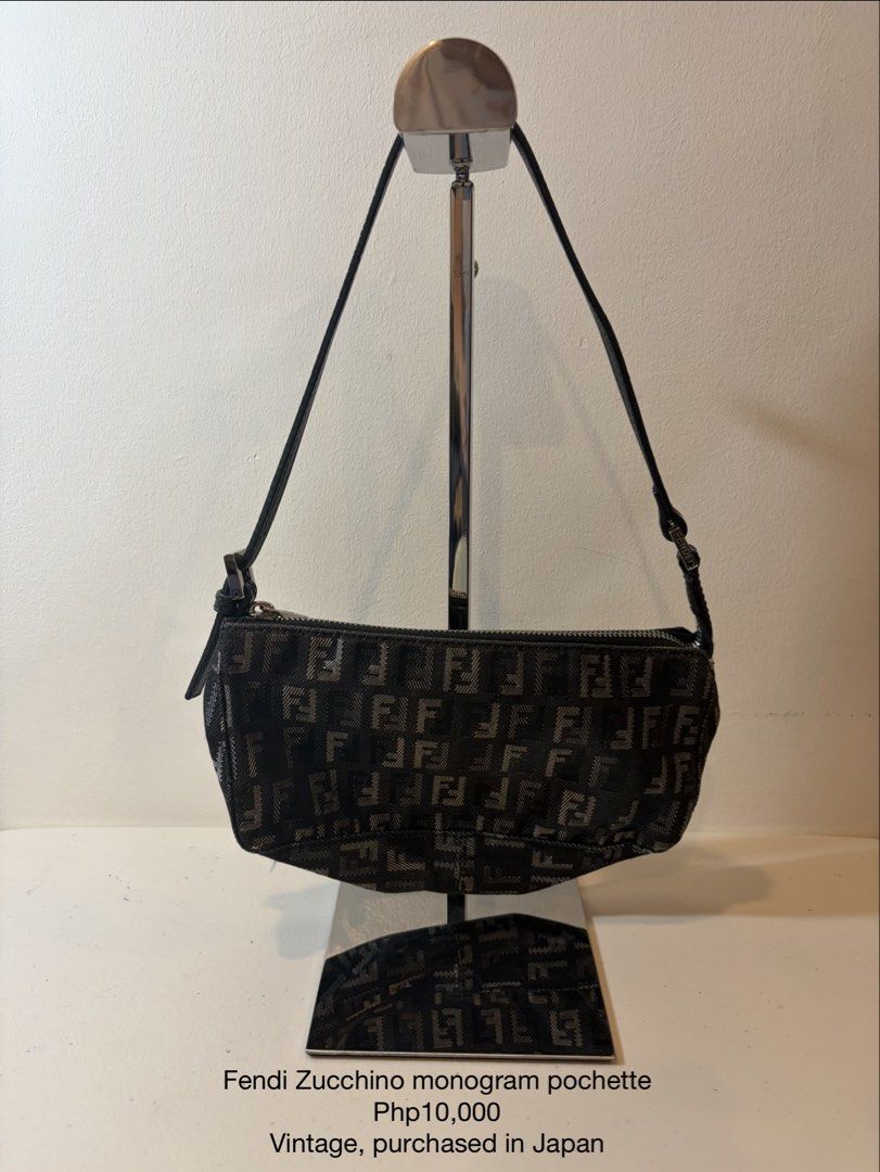 Fendi Zucchino Monogram Pochette Handbag (Category: Luxury Bags & Wallets) located in Bacoor. Submitted by tin.teodosio (Listing ID 1465619703, Image 1). Description: - Authentic vintage Fendi Zucchino monogram pochette - Sourced directly from Japan - Dark monogram fabric with black leather shoulder strap - Shiny silver-tone hardware and secure zipper top closure - Clean overall condition, well-maintained strap and hardware - Classic small size, 