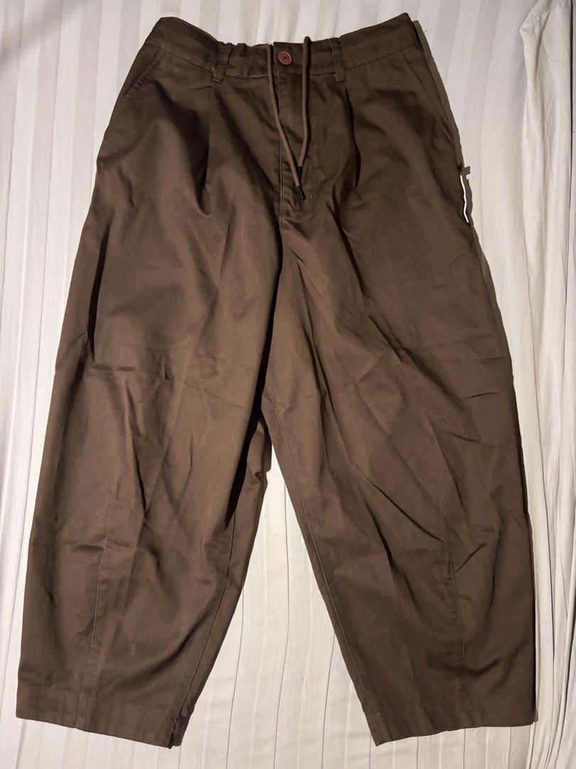 Fingercroxx Ver-Tex Series Brown Pants (Category: Trousers) located in San Jose del Monte. Submitted by icarus.falls (Listing ID 1465723224, Image 1). Description: - Brand: Fingercroxx (Ver-Tex series) - Color: Dark Brown - Size: 165/66Y - Material: Comfortable cotton and polyester blend - Waist: Adjustable drawstring with branded aglets and button closure - Fit: Relaxed fit with subtle front pleating - Detail: Unique text label patch on the back