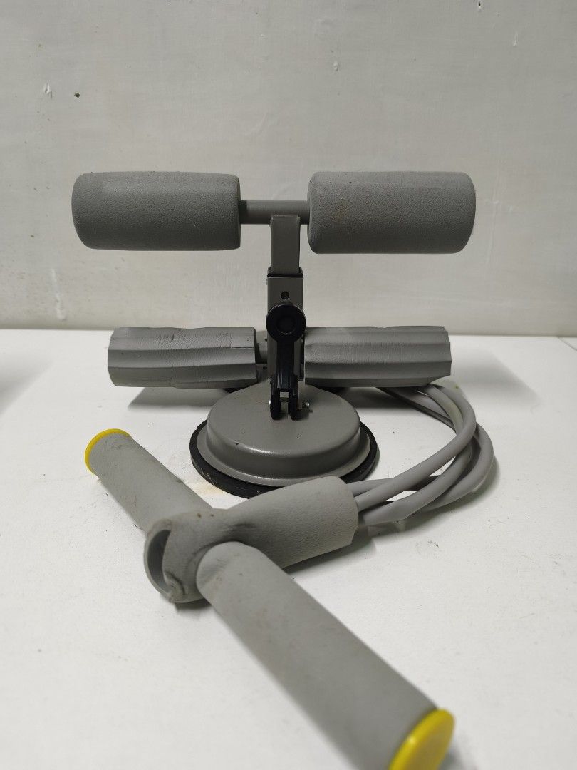 Floor Sit Up Bar with Resistance Bands (Category: Toning & Stretching Accessories) located in San Jose del Monte. Submitted by missalipot (Listing ID 1465746381, Image 1). Description: - Color: Grey - Base: Strong suction cup for secure floor attachment - Features: Attached resistance pull ropes with foam handles for upper body workouts - Comfort: Padded foam rollers on top and middle bars - Adjustability: Center lever for height adjustment - Ide
