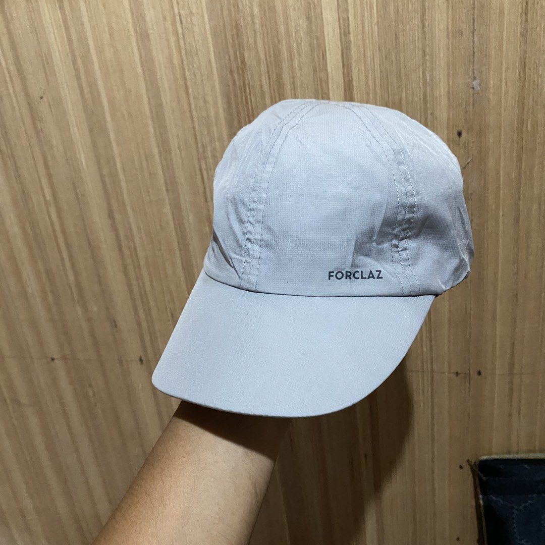 Forclaz Grey Hiking Cap (Category: Caps & Hats) located in Dipolog. Submitted by thriftcher (Listing ID 1465683049, Image 1). Description: - Brand/Model: Forclaz hiking cap - Color: Grey - Material: Lightweight and quick-dry fabric - Sun Protection: Curved brim to shield your face - Fit: Adjustable back strap with secure velcro closure - Condition: like new Dm.