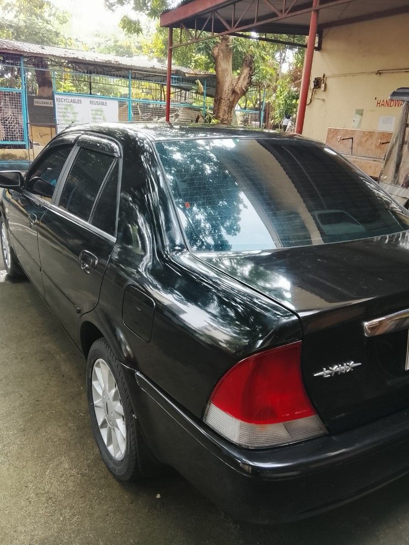 Ford Laser 1.6 Ghia (A) (Category: Used Cars) located in Muntinlupa City. Submitted by calmgem_4c3336 (Listing ID 1465701479, Image 3). Description: Ford Lynx 1.6 GSI 2002 AT model Complete original papers (OR Cr ID DOS) 2 keys REGISTERED 2026-2027 AUTOMATIC TRANSMISSION BRAND NEW BATTERY JULY2026 4 NEW kyb SHOCK ABSORBER 4 BRAND NEW TIRES WALANG KALAMPA New LTO issued white plates cold AC HID HEADLIGHTS Black tint FOG LAMP Power steering Power d