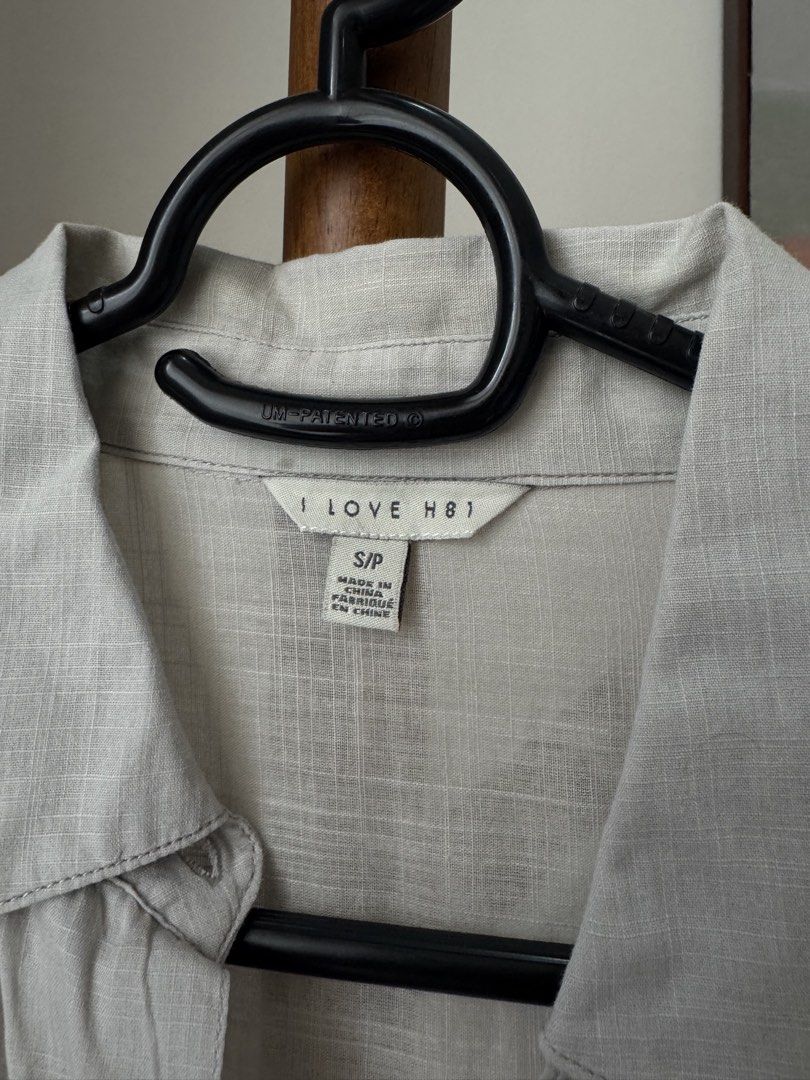 Forever 21 Light Grey Long Sleeve Button-Up (Category: Longsleeves) located in Pasig City. Submitted by kutleyn (Listing ID 1465656589, Image 2). Description: - Brand: I Love H81 - Color: Light grey with dark buttons - Style: Long sleeve button-up with classic collar and front pocket - Fabric: Textured material - Size: S - Condition: Clean and ready to wear.