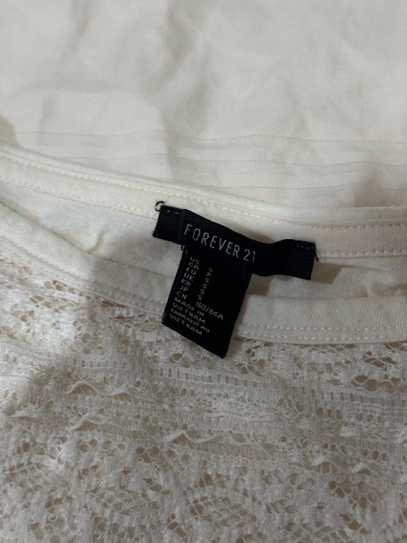 Forever 21 Light Pink Lace Short Sleeve Top (Category: Blouses) located in Quezon City. Submitted by gentle_le (Listing ID 1465650130, Image 3). Description: Front: see-through lace pattern Back: solid Original price: ₱900+ .