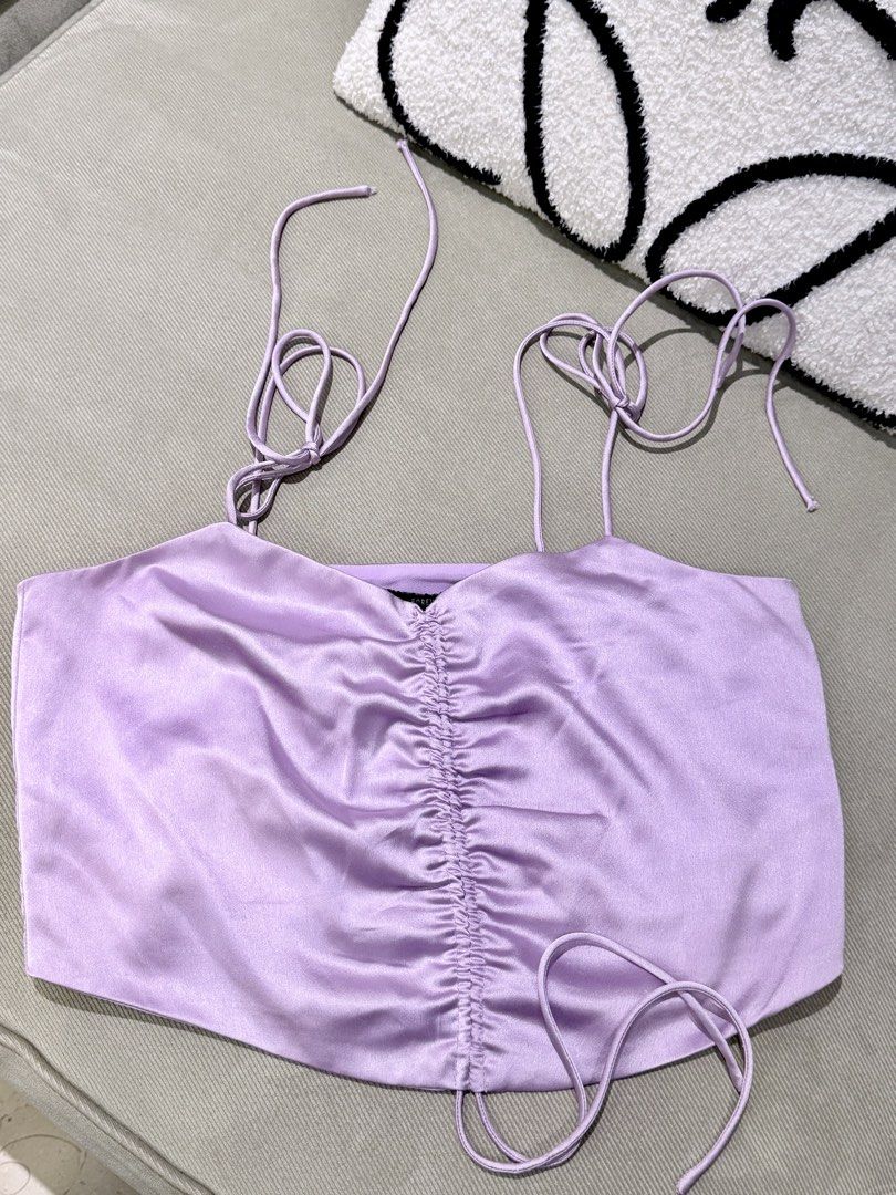Forever 21 lilac self tie satin top (Category: Sleeveless) located in Taguig. Submitted by annebydesign (Listing ID 1465691409, Image 3). Description: Hi all. Selling this Forever 21 Lilac satin camisole self tie top for ₱300 •Like new. Matagal na to sakin -I think this is from sm aura or US limot k na •Fits small to med •self tie sa shoulder and front Loc: Taguig BGC Mop: GCash/ Bank transfer/ COD Mod: Courier or Rider pick up.