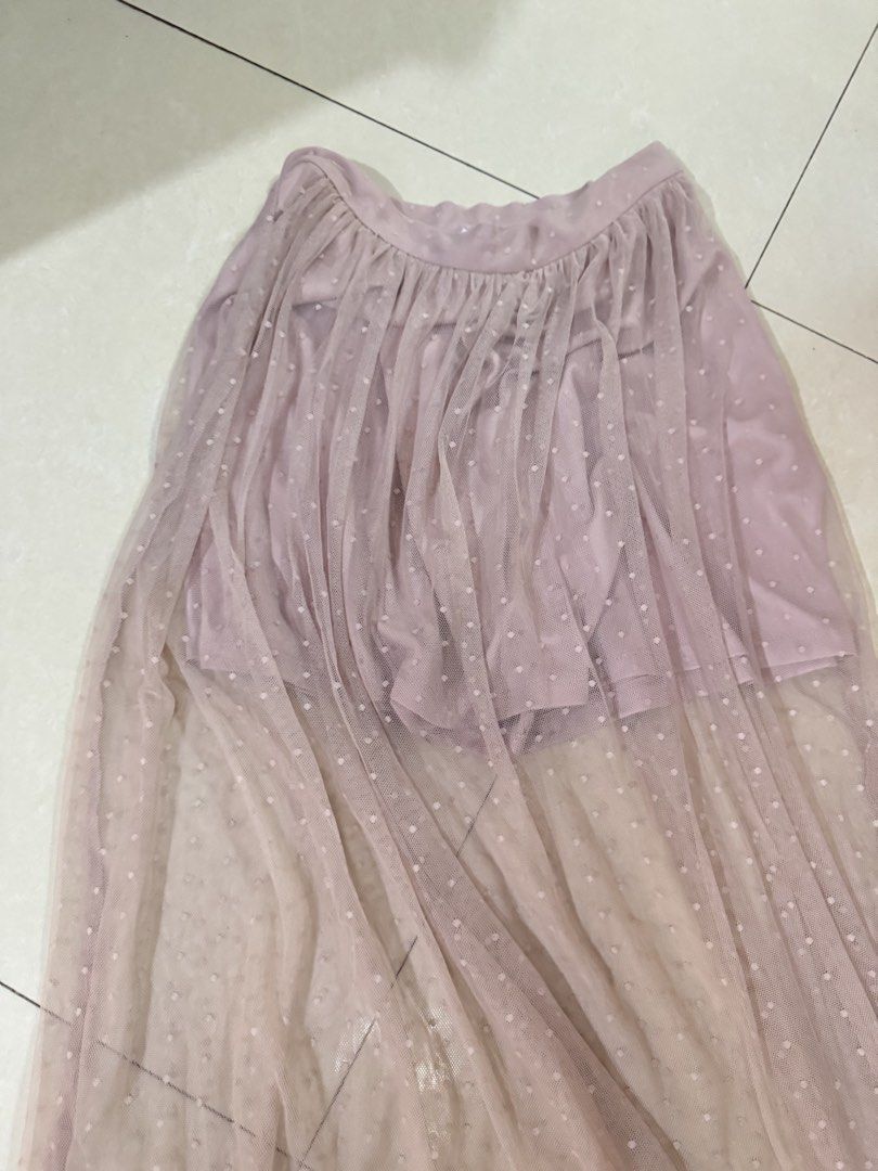 Forever 21 Pink Mesh Polka Dot Maxi Skirt (Category: Skirts) located in Quezon City. Submitted by sweetlyluxe (Listing ID 1465606464, Image 2). Description: - Brand: Forever 21 - Size: S - Color: Pink with all-over cute polka dots - Material/Design: Sheer mesh overlay with a built-in inner lining for safe, comfortable wear - Closure: Hidden back zipper for easy wearing - Style: Float, flowy, and dreamy maxi length.