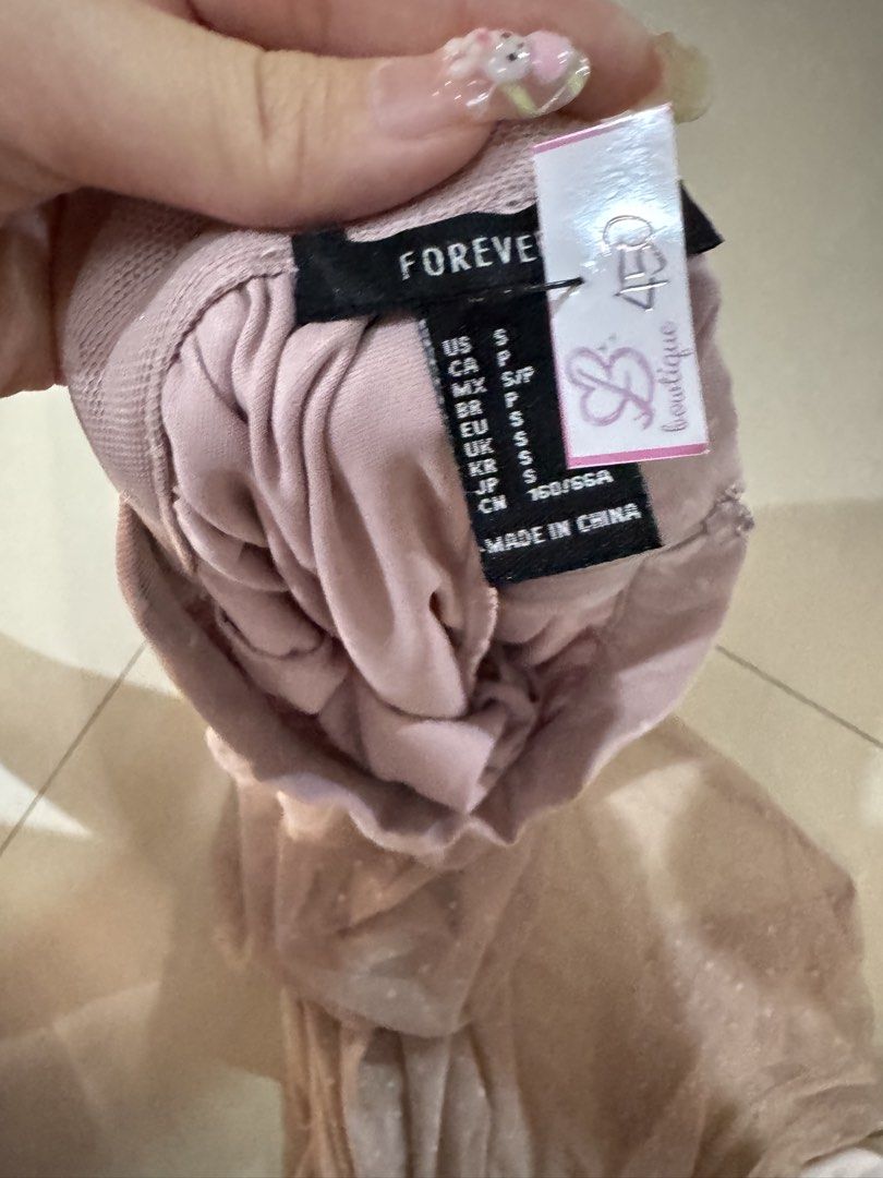 Forever 21 Pink Mesh Polka Dot Maxi Skirt (Category: Skirts) located in Quezon City. Submitted by sweetlyluxe (Listing ID 1465606464, Image 3). Description: - Brand: Forever 21 - Size: S - Color: Pink with all-over cute polka dots - Material/Design: Sheer mesh overlay with a built-in inner lining for safe, comfortable wear - Closure: Hidden back zipper for easy wearing - Style: Float, flowy, and dreamy maxi length.