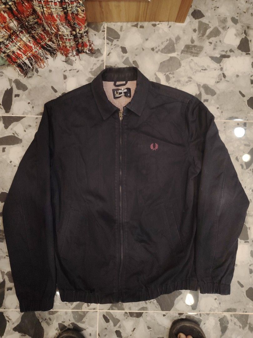 Fred Perry Harrington Jacket Dark Navy (Category: Coats, Jackets and Outerwear) located in Calapan. Submitted by thriftopia_12 (Listing ID 1465608023, Image 1). Description: - Brand: Fred Perry - Style: Harrington Jacket (Code: J7210) - Color: Dark Navy - Material: 100% Cotton body with classic check pattern lining - Details: Full zip front, classic collar, signature embroidered chest logo - Origin: Made in China - Condition: Excellent pre-loved 