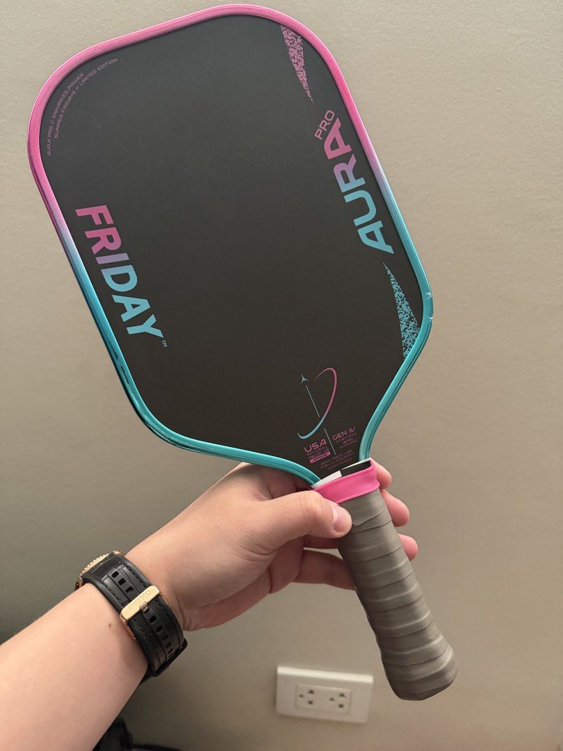Friday Aura Pro Pickleball Paddle Limited Edition (Vice) (Category: Racket and Ball Sports) located in Caloocan City. Submitted by keithadria32005 (Listing ID 1465589448, Image 1). Description: - Model: Friday Aura Pro Gen IV (Summer Fridays Limited Edition) - Design: Pink and teal gradient edge guard with standard black face and pink/blue graphics - Specs: Carbon fiber face, 16mm thickness, elongated shape - Handle: Wrapped grip with customized 