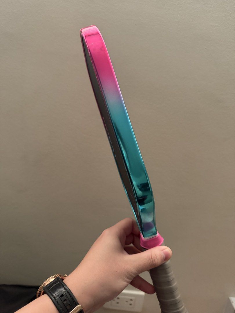 Friday Aura Pro Pickleball Paddle Limited Edition (Vice) (Category: Racket and Ball Sports) located in Caloocan City. Submitted by keithadria32005 (Listing ID 1465589448, Image 2). Description: - Model: Friday Aura Pro Gen IV (Summer Fridays Limited Edition) - Design: Pink and teal gradient edge guard with standard black face and pink/blue graphics - Specs: Carbon fiber face, 16mm thickness, elongated shape - Handle: Wrapped grip with customized 