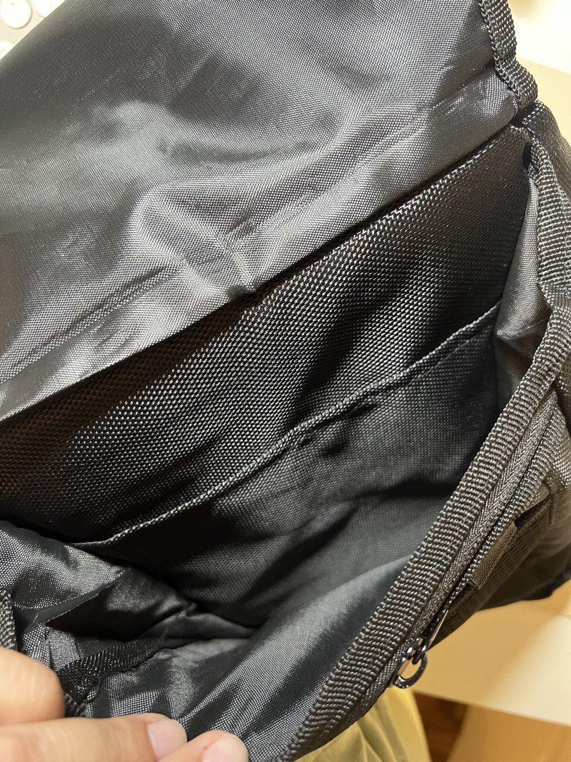 Fujifilm X Series Black Messenger Camera Bag (Category: Camera Bags & Carriers) located in Las Pinas. Submitted by csco.mnl (Listing ID 1465673934, Image 3). Description: - Brand: Fujifilm X Series - Color: Classic Black - Material: Durable, weather-ready nylon - Storage: Front zipper pocket, mesh pocket under flap, and main compartment with inner divider sleeves - Comfort: Adjustable shoulder strap with padded support - Condition: Clean inside a