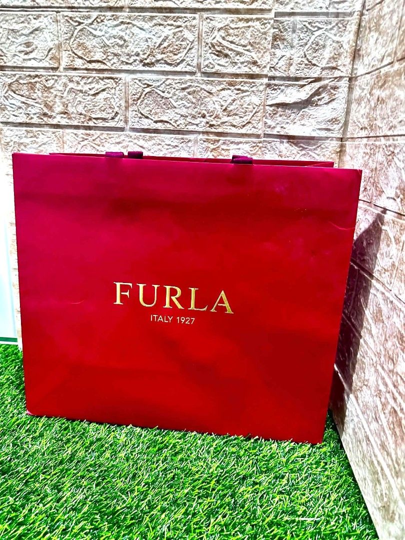 FURLA Authentic Paper Bag 🛍️✨ (Category: Luxury Bags & Wallets) located in Antipolo. Submitted by saribymonica (Listing ID 1465607404, Image 1). Description: FURLA Authentic Paper Bag 🛍️✨ Decluttering Pre-loved / unused paper bags from my personal collection. 📌 please check photos for actual size and condition. 📌 Sold as is, based on actual photos. 📌 Perfect for gifting, storage, or reuse. ♻️ Priced low for easy decluttering. 💕 Reasonable a