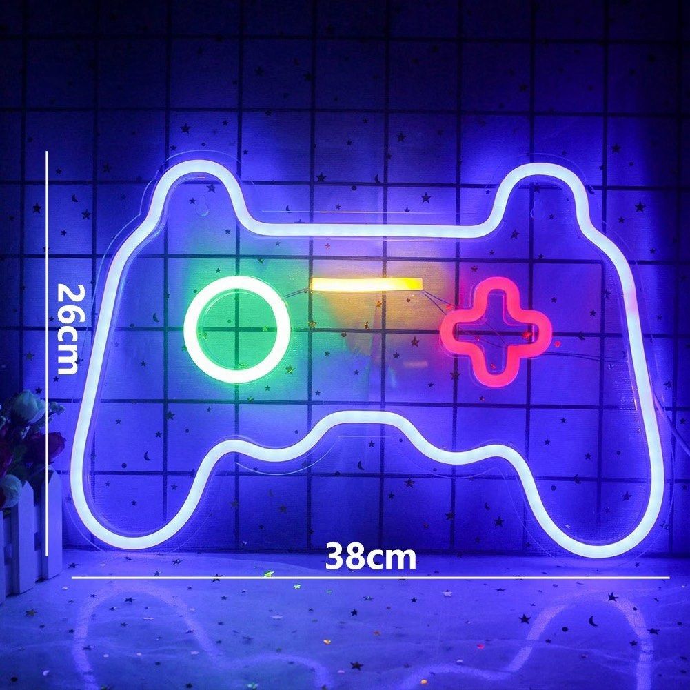 Gaming Controller LED Neon Light Sign Wall Decor (Category: Controllers) located in Quezon City. Submitted by rochichan (Listing ID 1465663388, Image 1). Description: - Design: Gamepad-shaped LED neon light with bright blue outline and multi-color accents (red, yellow, green) - Power: Convenient USB-powered cable included - Usage: Perfect for bedroom walls, gaming setups, or streaming backdrops - Condition: Brand new, powers on nicely with a vivi