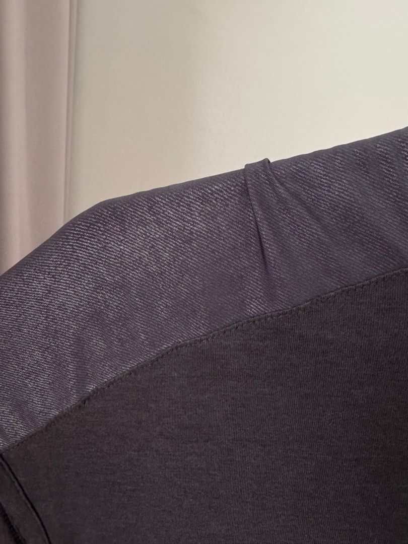 Gap Dark Grey Blouse (Category: Shirts) located in Pasig City. Submitted by kutleyn (Listing ID 1465657788, Image 3). Description: - Brand: Gap - Size: XS - Color: Dark Grey - Sleeves: Short sleeves with stylish sheer patterned panels - Neckline: Rounded neckline with a small zip closure at the back collar - Details: Slight gathering at the front hem for a flattering fit - Condition: Excellent pre-loved condition (ready to wear).
