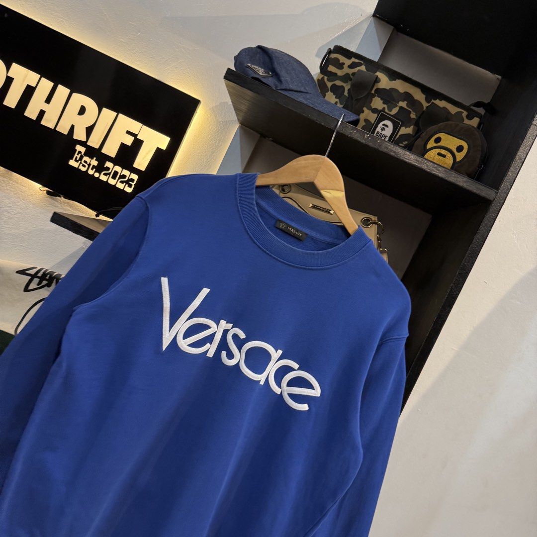 Gianni Versace Blue Embroidered Logo Sweatshirt (Category: Coats, Jackets and Outerwear) located in Manila. Submitted by carbungcoalex (Listing ID 1465744713, Image 2). Description: VERSACE EMBROID BLUE SWEATSHIRT 22 by 27 Good Condition Complete tags 2K CLAIM.