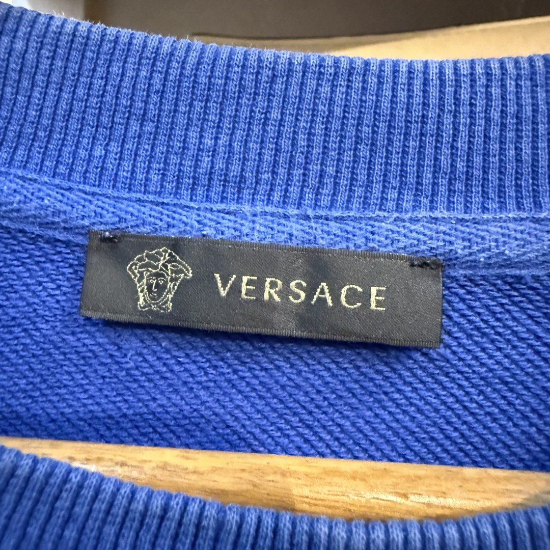 Gianni Versace Blue Embroidered Logo Sweatshirt (Category: Coats, Jackets and Outerwear) located in Manila. Submitted by carbungcoalex (Listing ID 1465744713, Image 3). Description: VERSACE EMBROID BLUE SWEATSHIRT 22 by 27 Good Condition Complete tags 2K CLAIM.